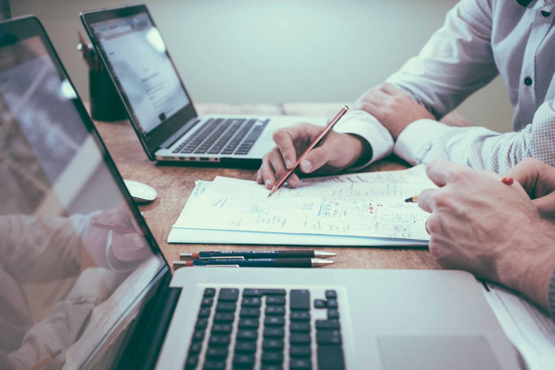 Sedona Digital technology consultants collaborating on system diagrams and digital transformation plans for banking and financial services clients.
